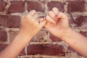 two girls keeping a promise