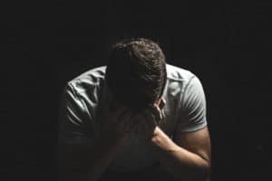 man feeling sad about life