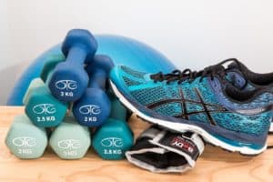 sneakers and dumbells on the floor