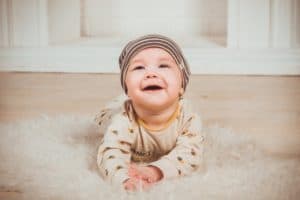 baby playing on the ground