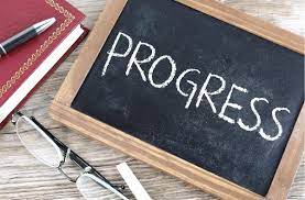 progress written on a chalkboard