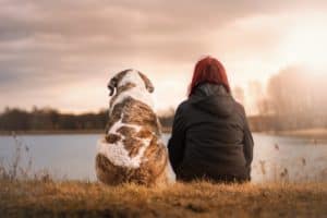 woman sitting with her dog