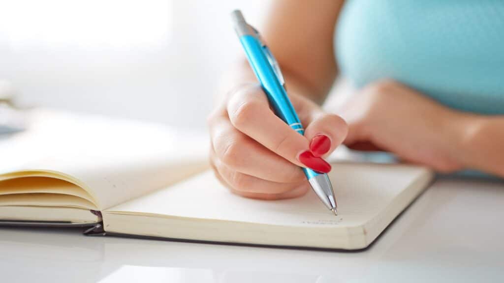 woman writing and journaling.