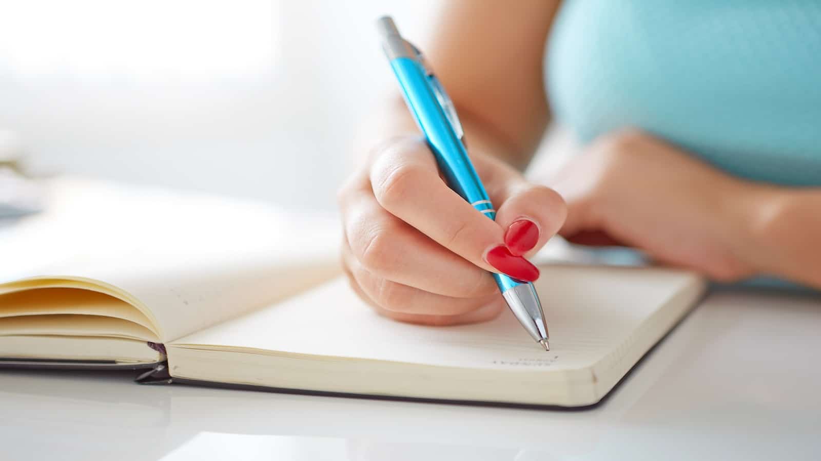 woman writing and journaling.