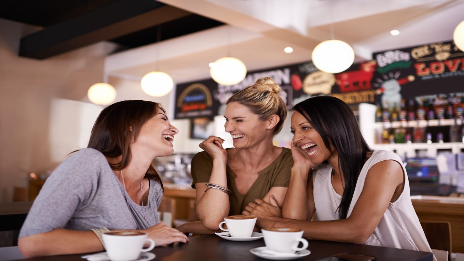 group of friends in cafe/restaurant talking.