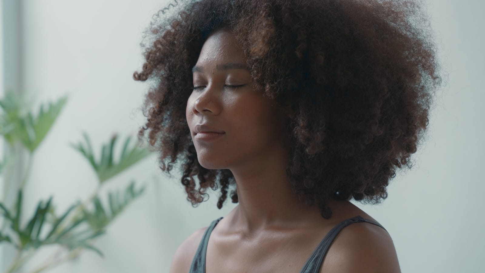 Woman practicing deep breathing meditating yoga.