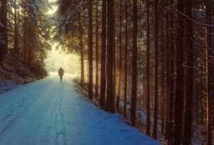 man walking through snow and seeing beauty