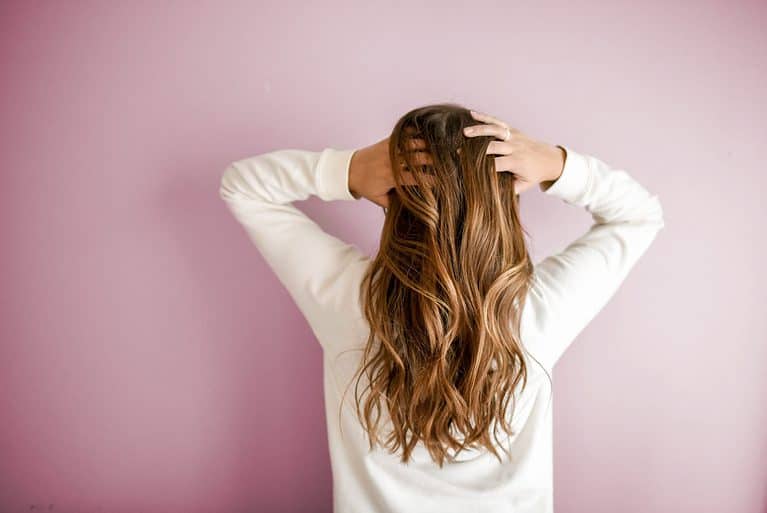 woman playing with her hair