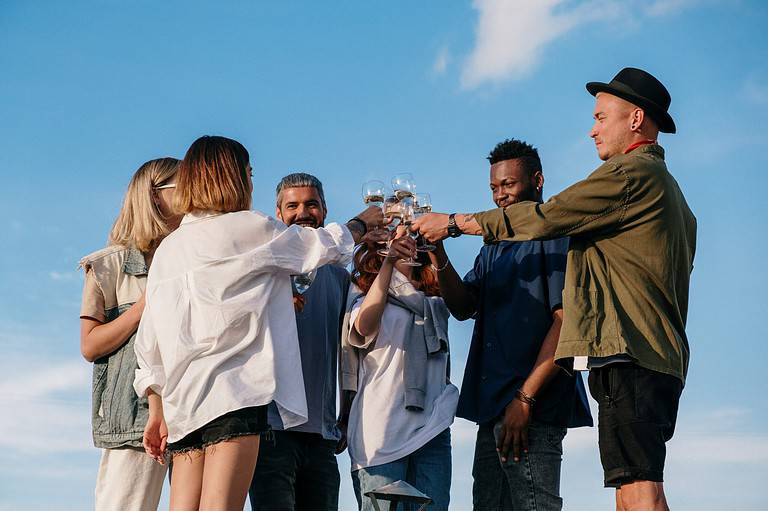 small circle of friends drinking wine