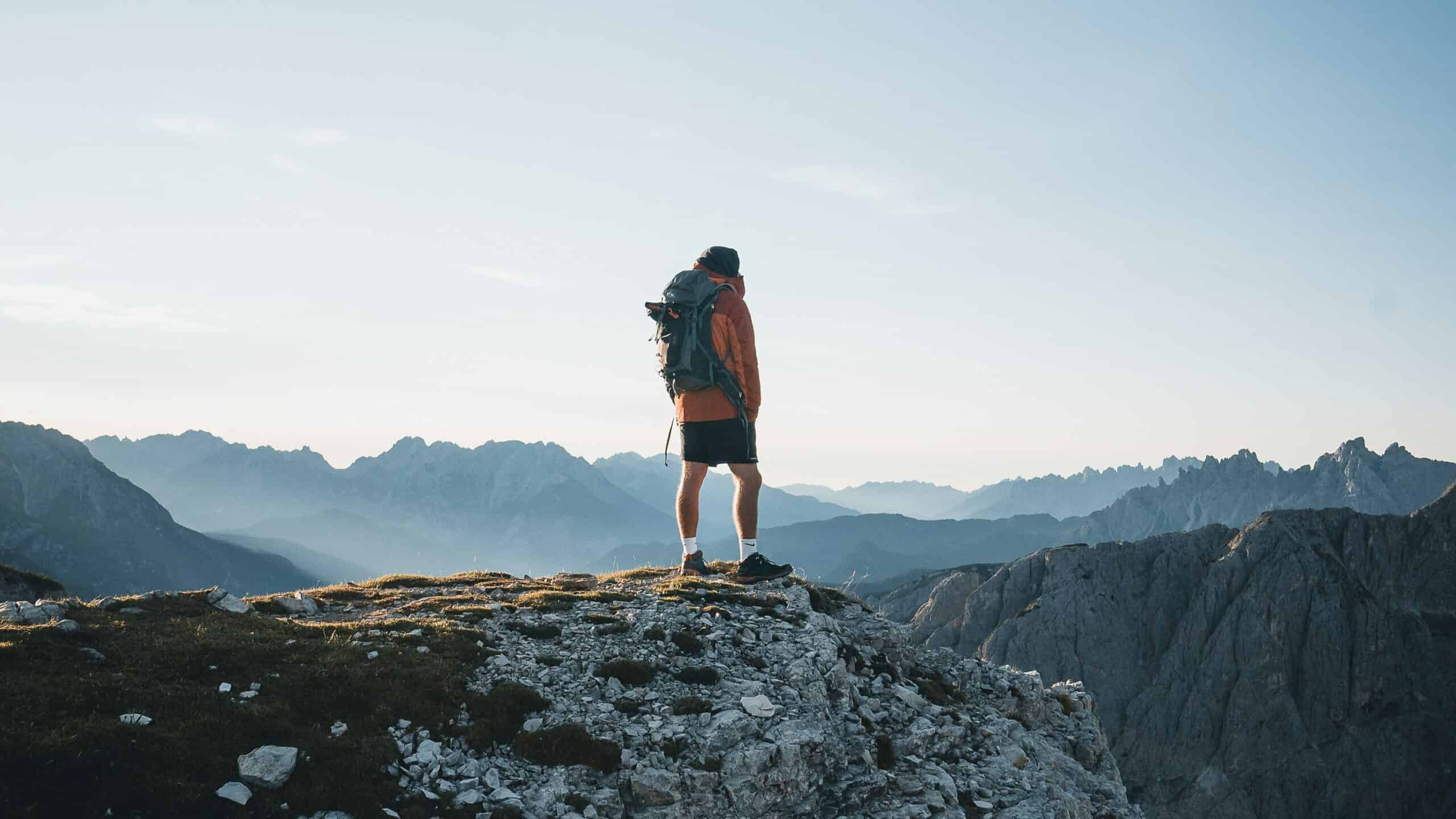 man climbing mountain