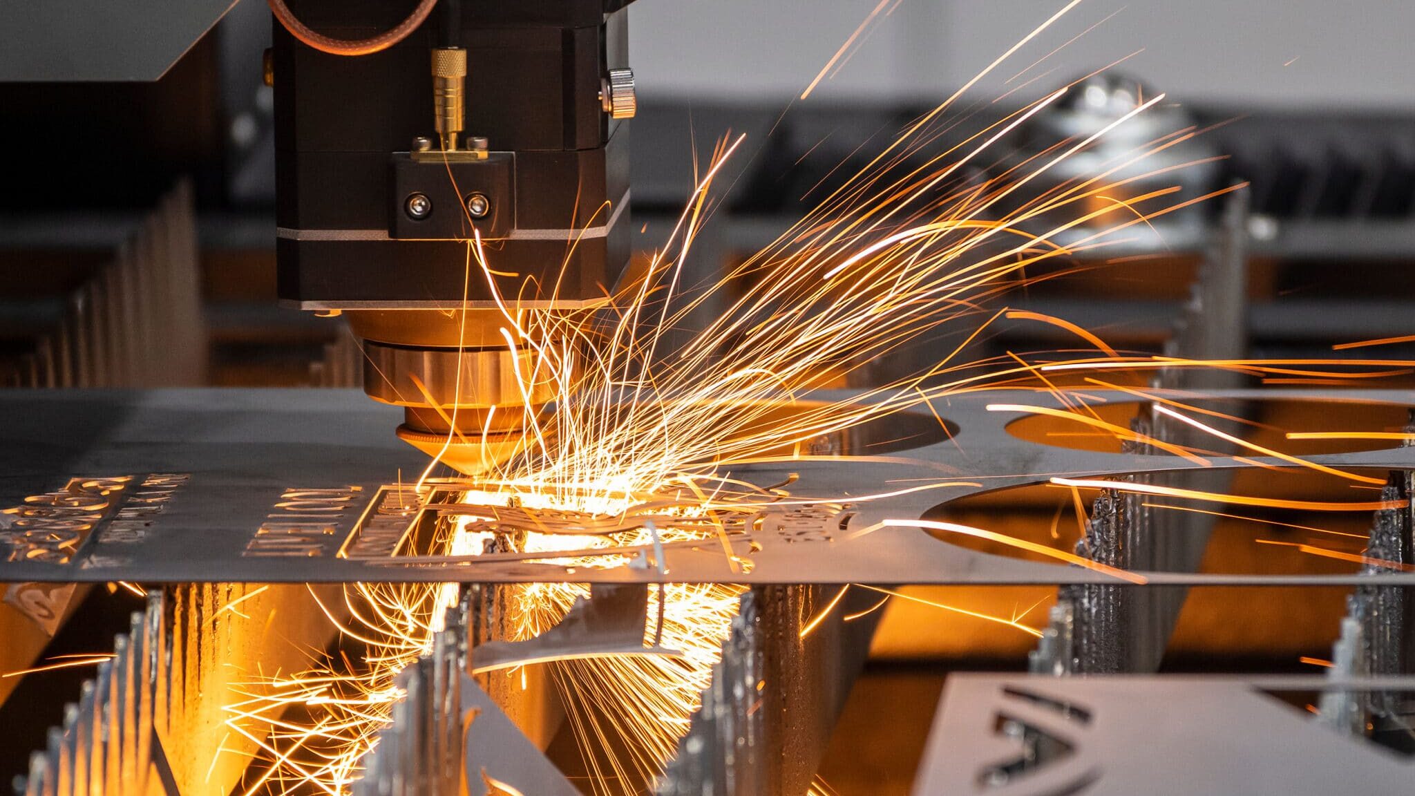 The fiber laser cutting machine cutting machine cut the metal plate. The hi-technology sheet metal manufacturing process by laser cutting machine.