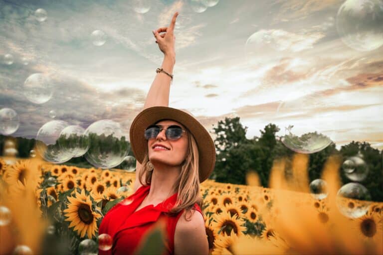 woman laughing in a field