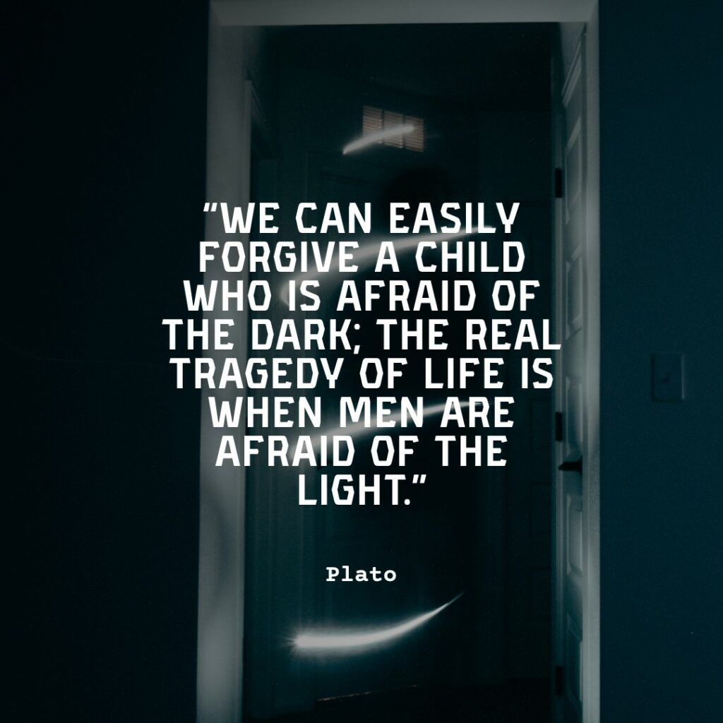 man sitting in the dark