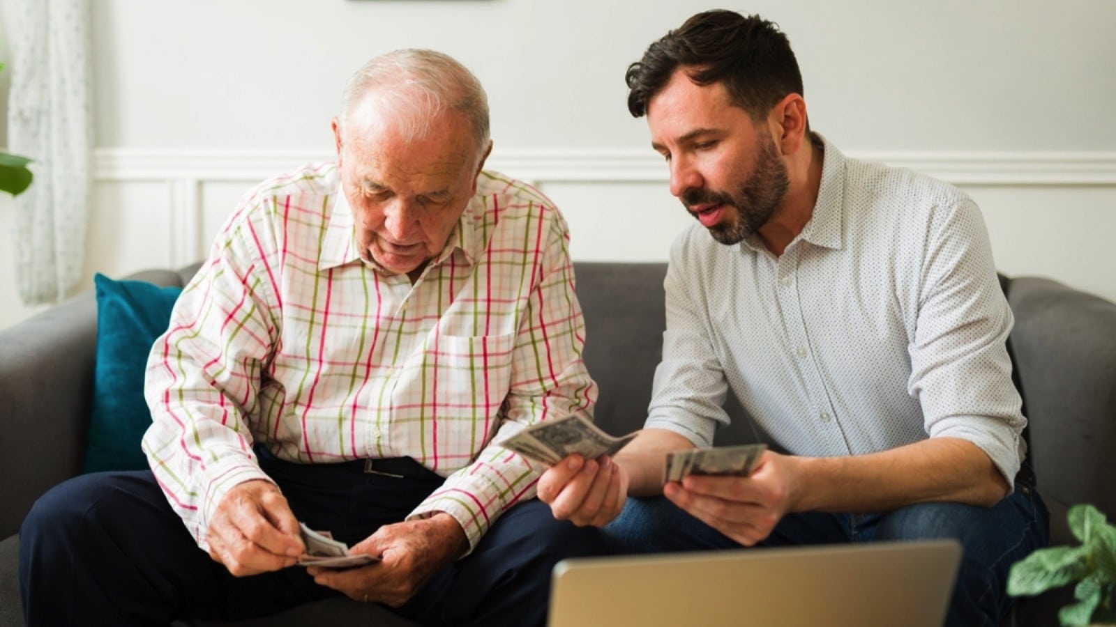 Man giving money to father