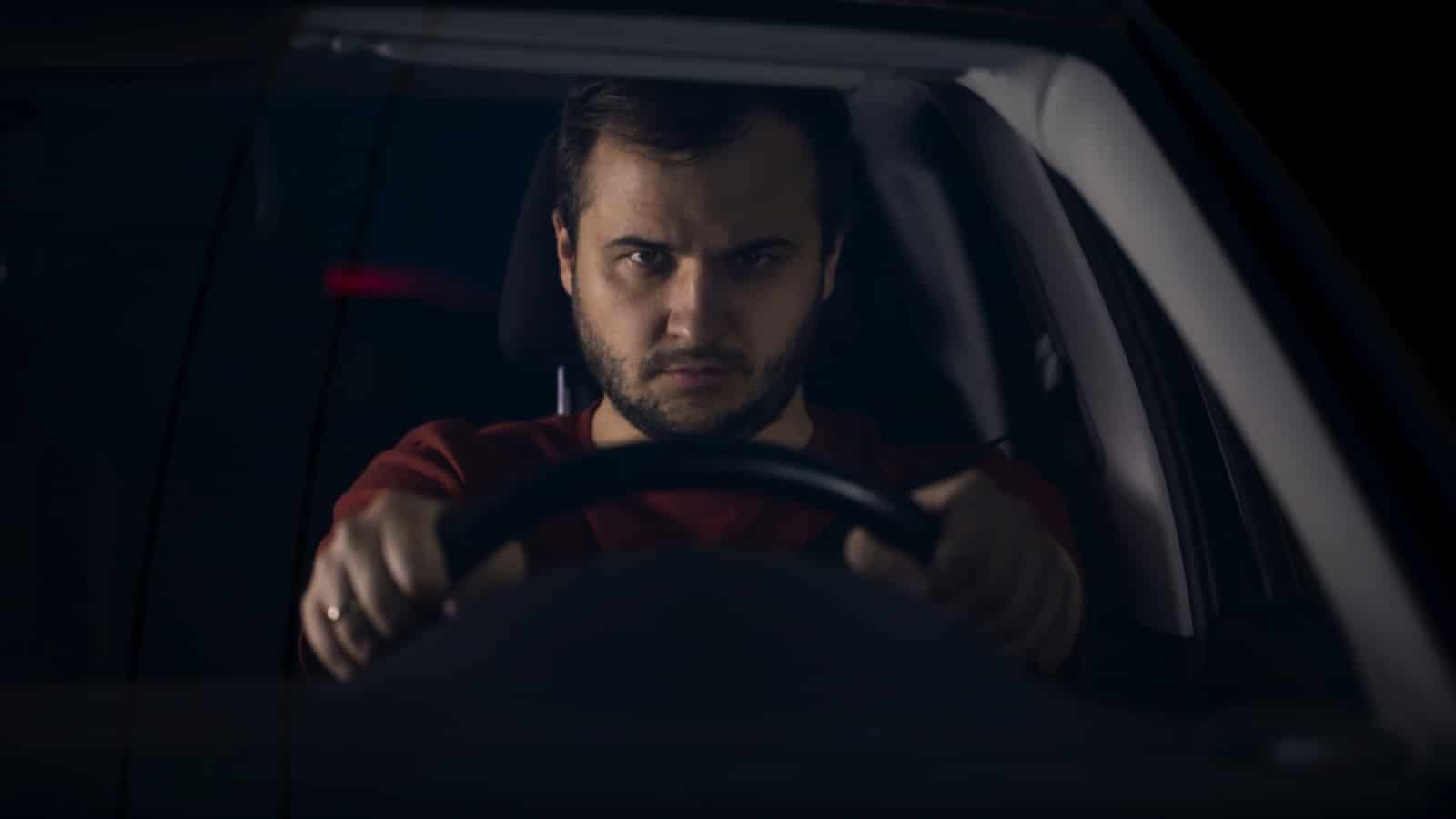Man in car stalking
