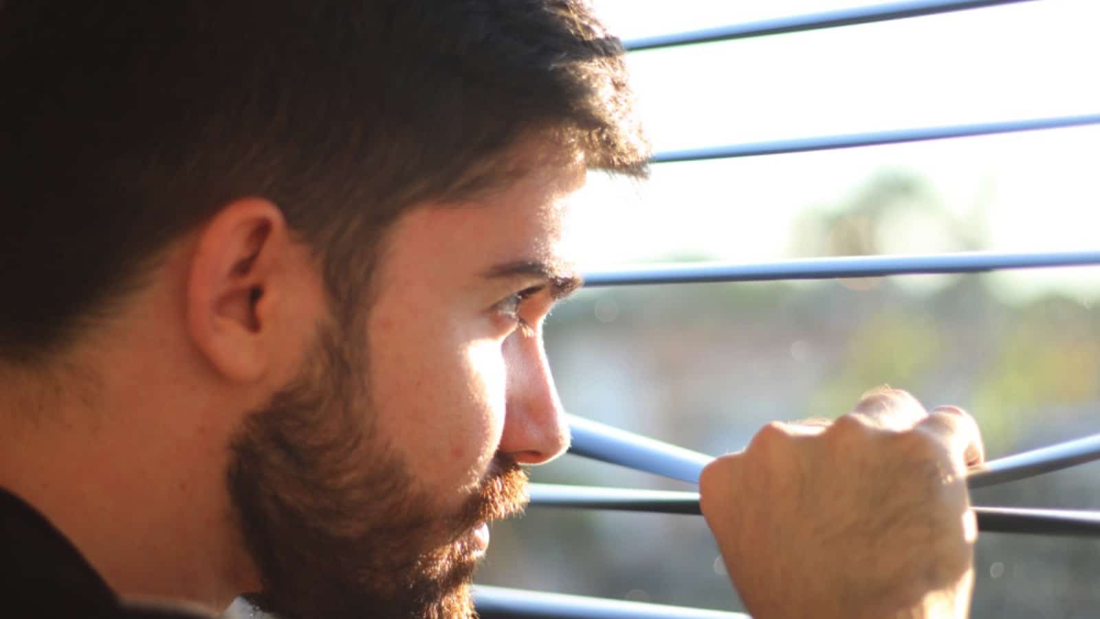 Man looking into someone window