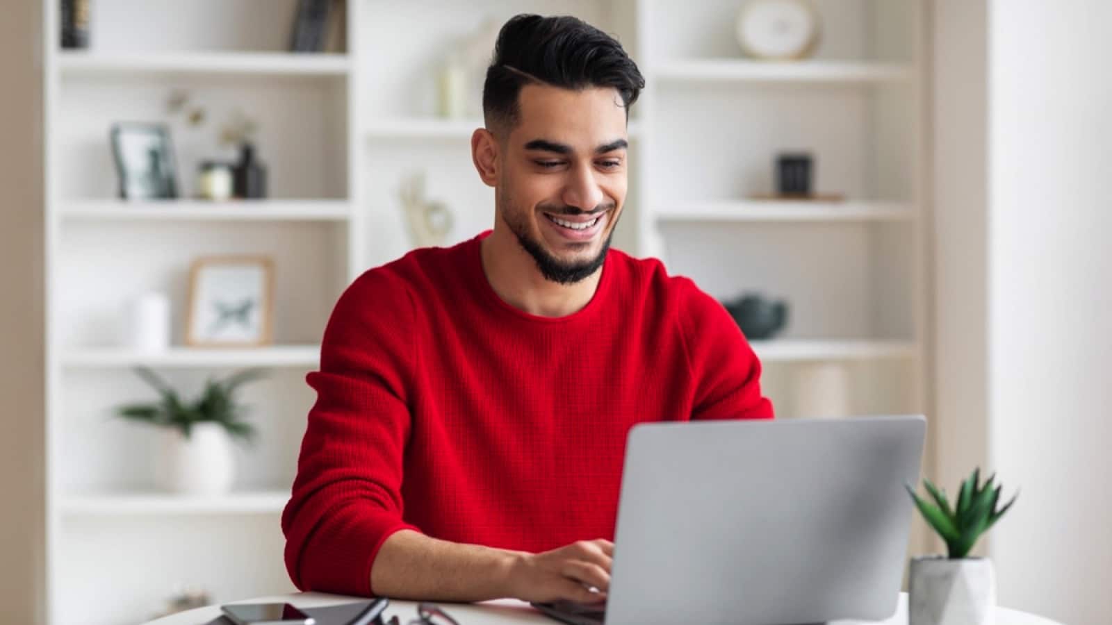 Man working with laptop affliate marketing