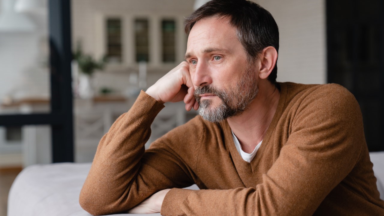 Man sitting down pondering