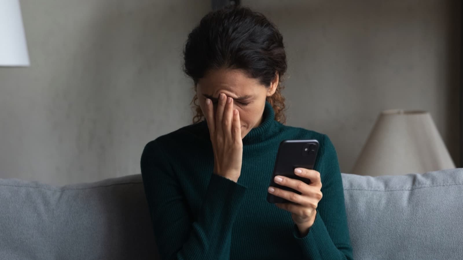 Sad woman with mobile