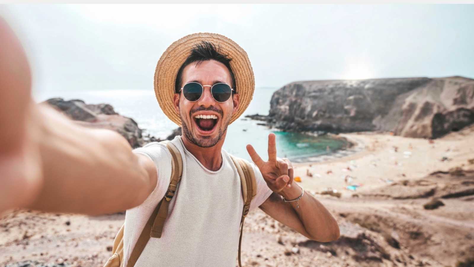 Tourist man taking selfie