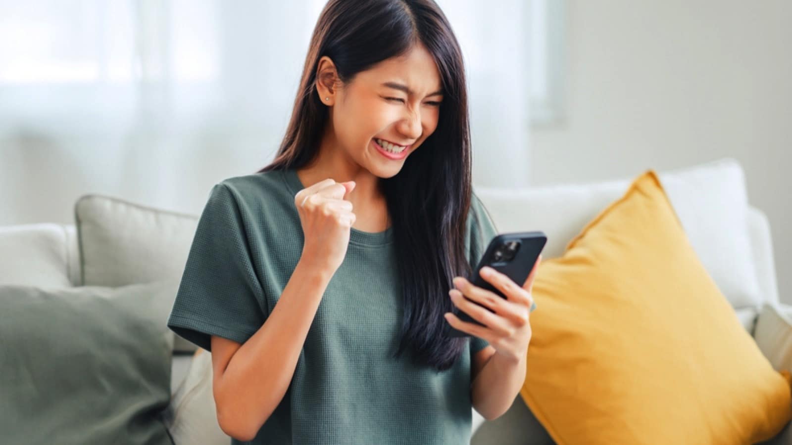 Woman excited seeing mobile