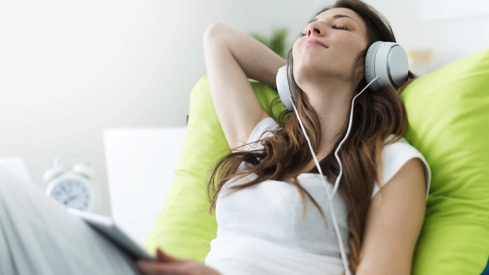 Woman listening to music in ipad