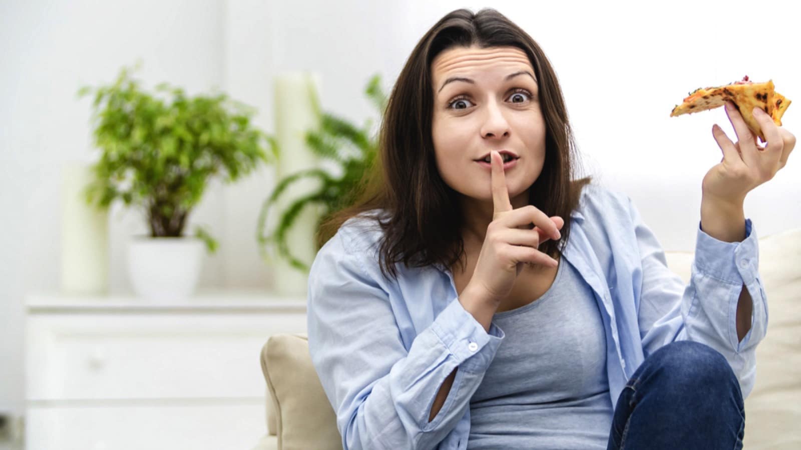 Woman saying silent when eating