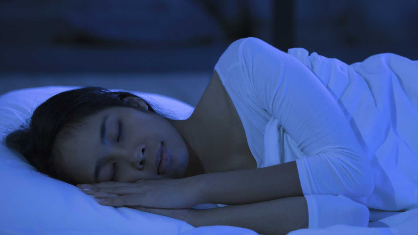 Woman sleeping in dark
