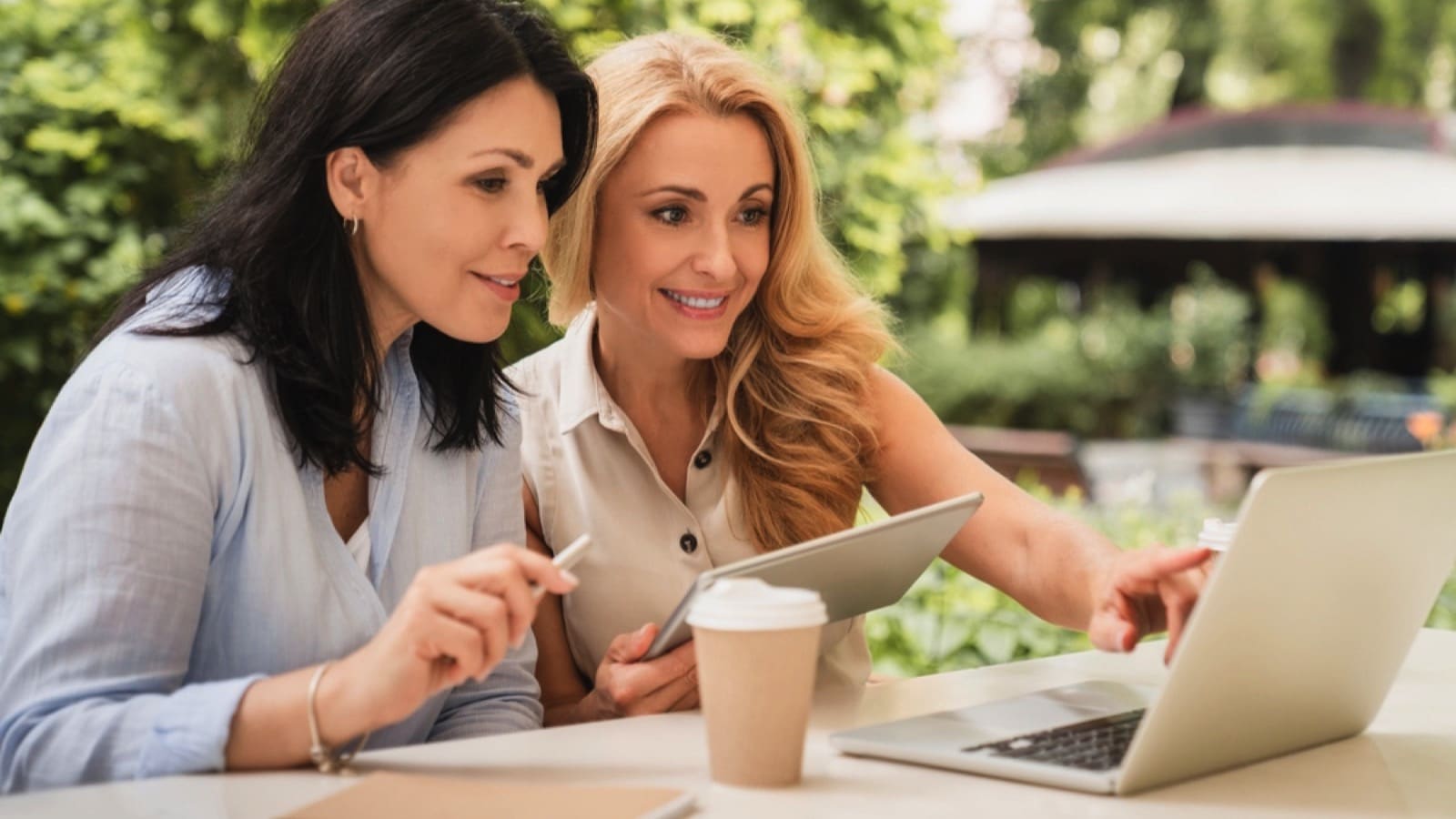 Woman with coffee sharing with friend