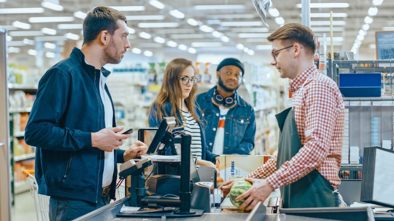 Customers in a grocery store line.