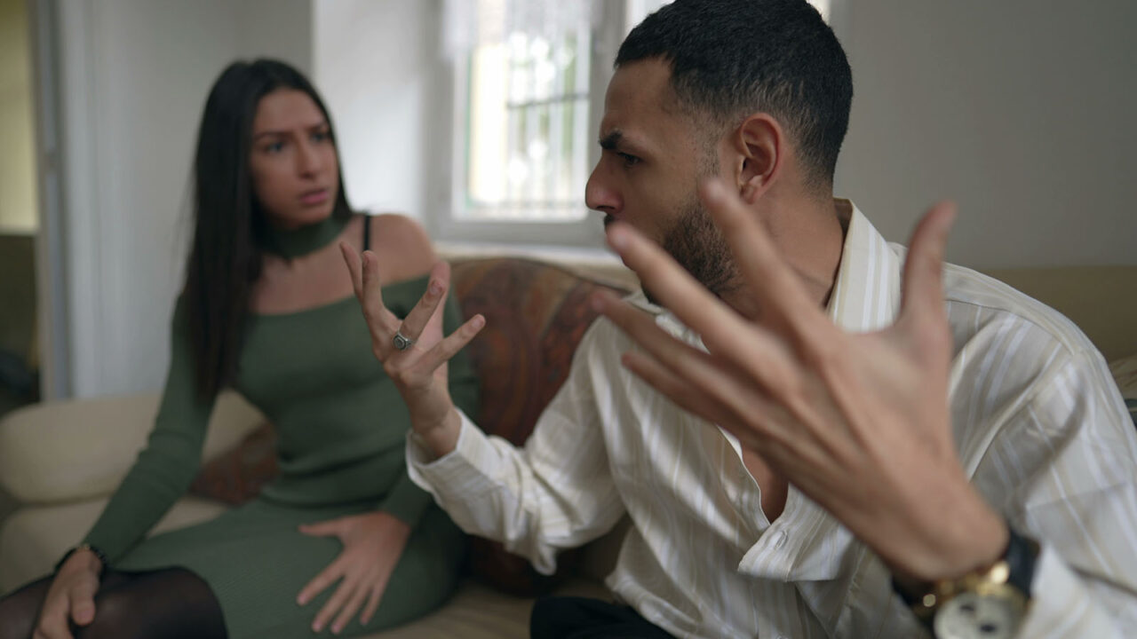 Relationship in crisis_ Young man and woman discussing and fighting with verbal altercation. Angry people yelling at each other