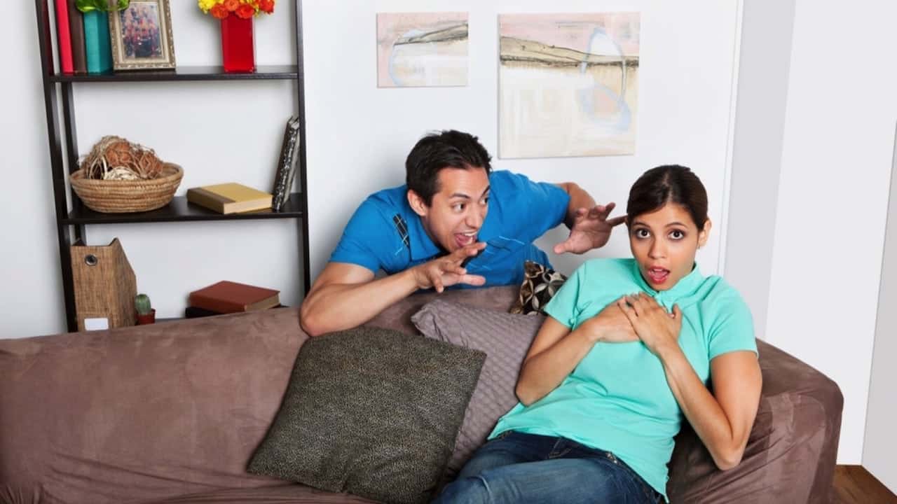 man pranking from behind.