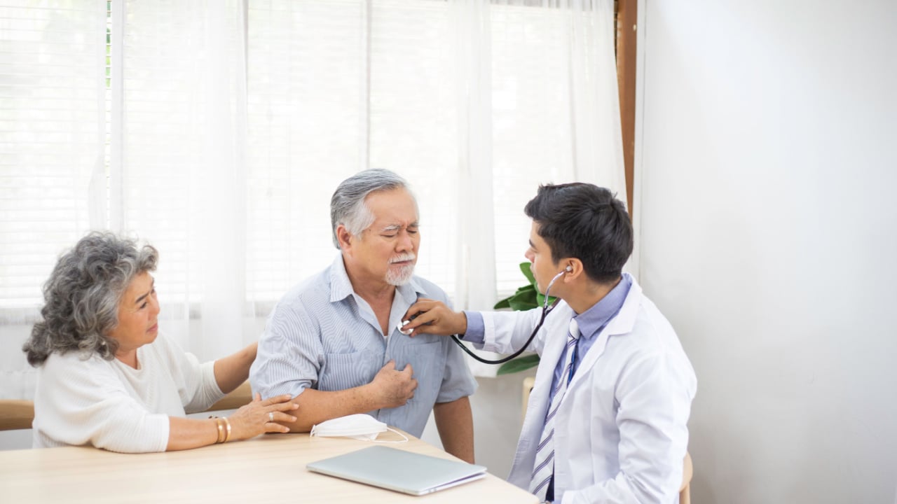 Older man at a doctor appointment checking on current health