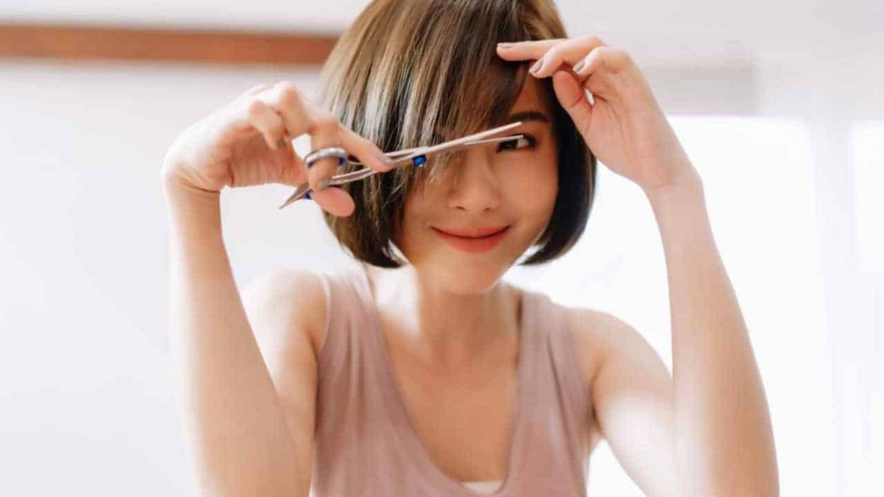 young woman doing hair cut