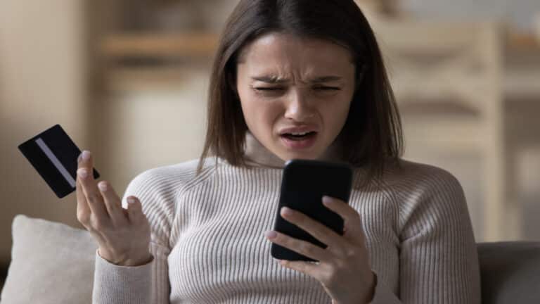 woman confused credit card bill