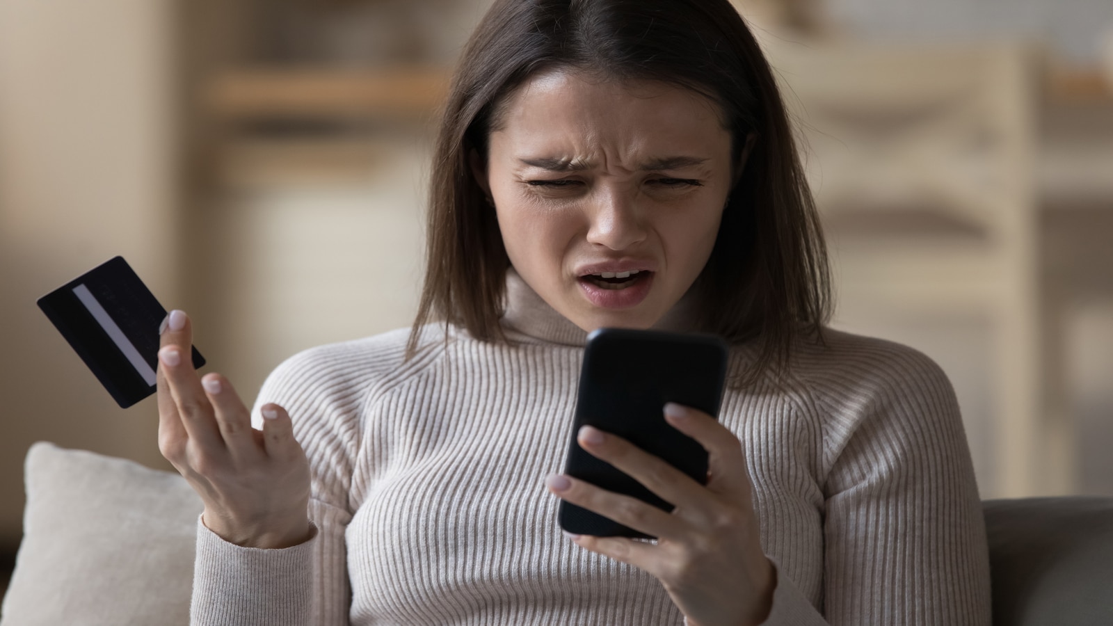 woman confused credit card bill