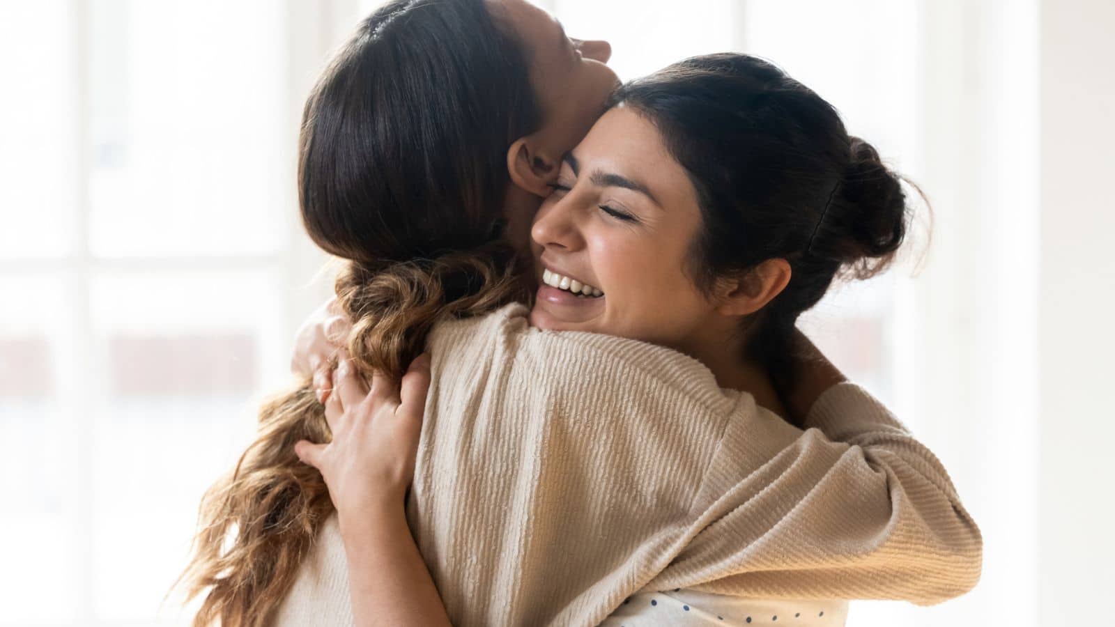 Friends hugging and supporting each other.