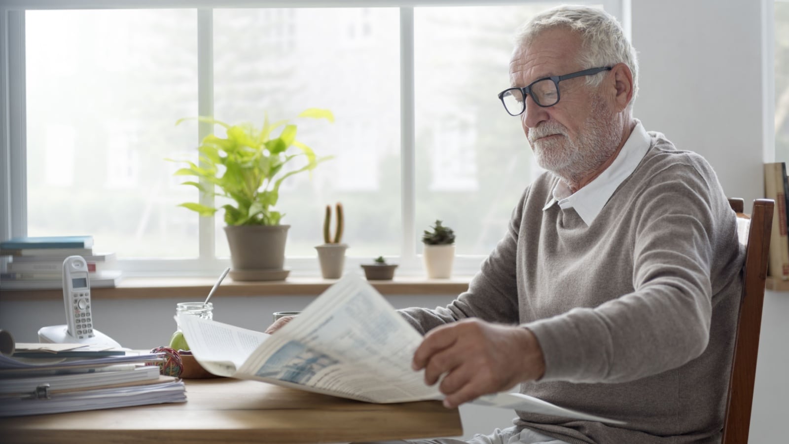 Senior Man Reading Newspaper Leisure Lunch Time.