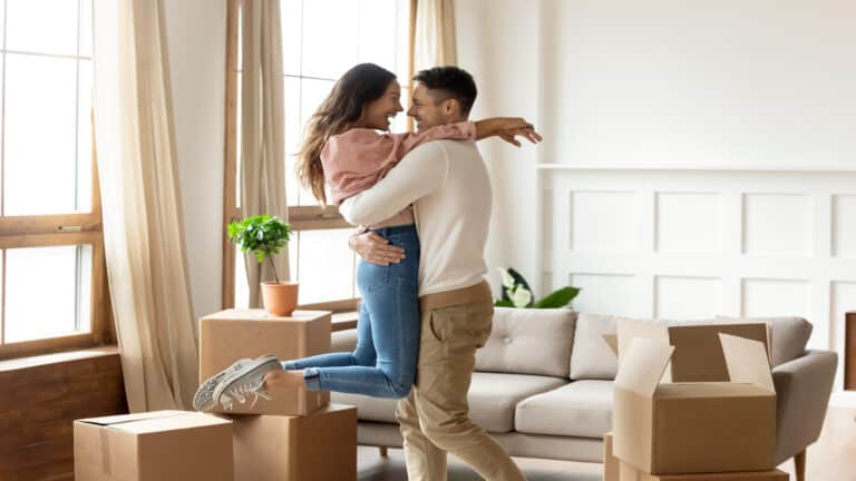 couple excited moving to new home.