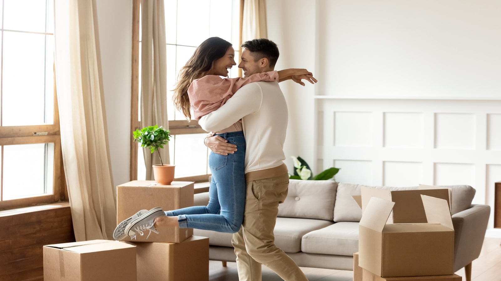 couple excited moving to new home.