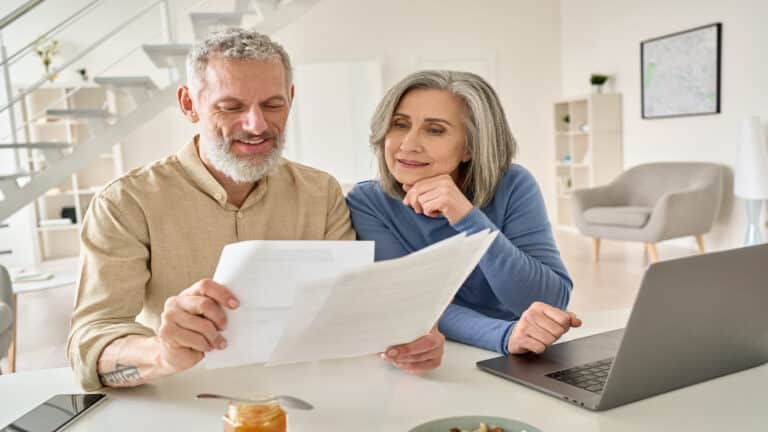 Couple looking at bills.