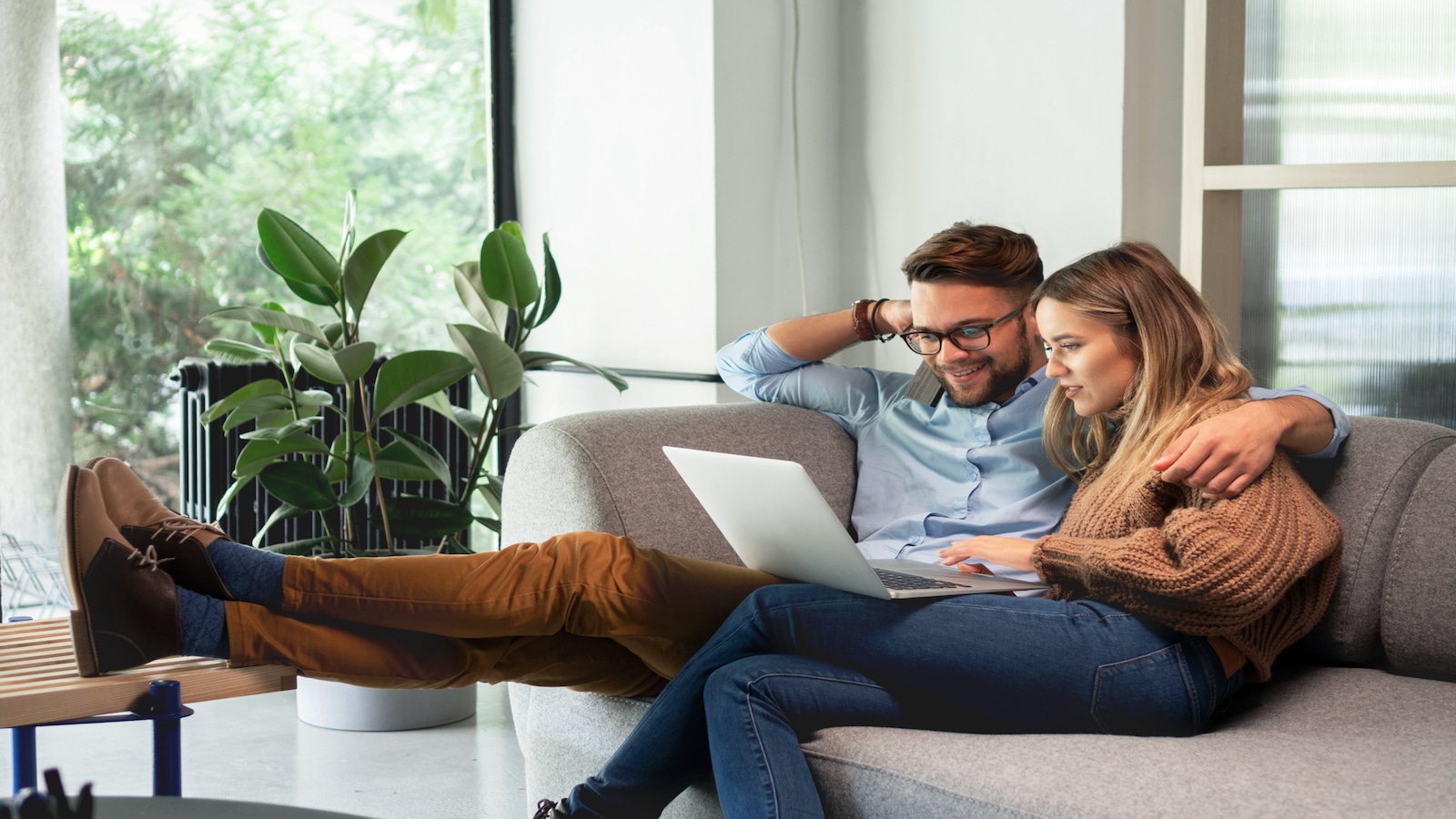 Couple looking at computer together.