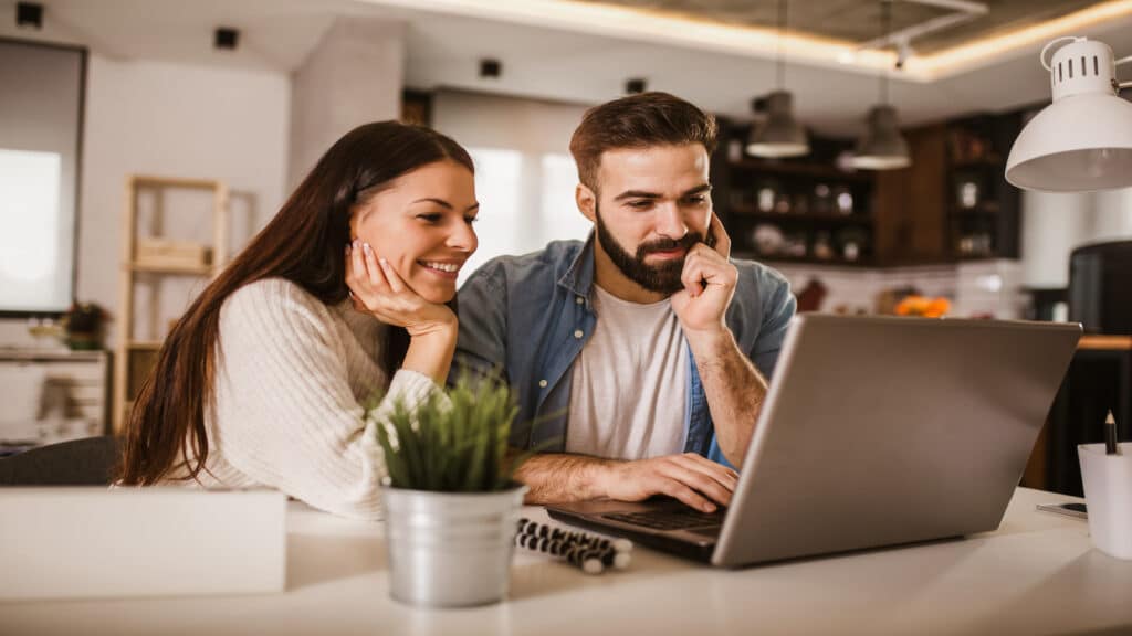 couple on laptop computer together.