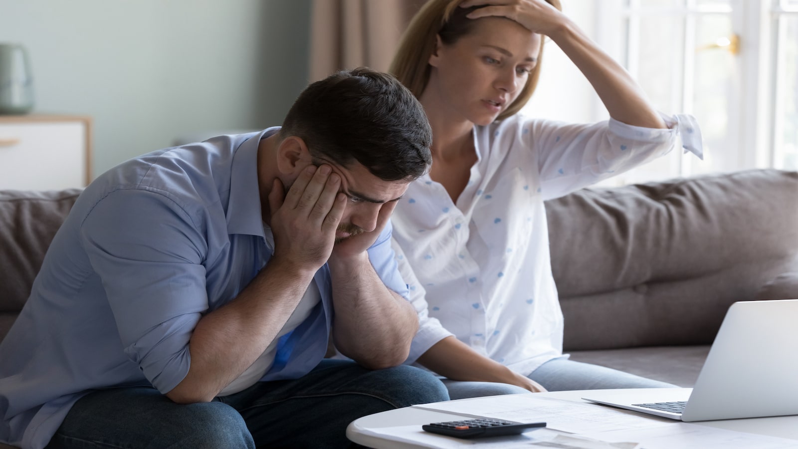 couple stressed about bills and money.