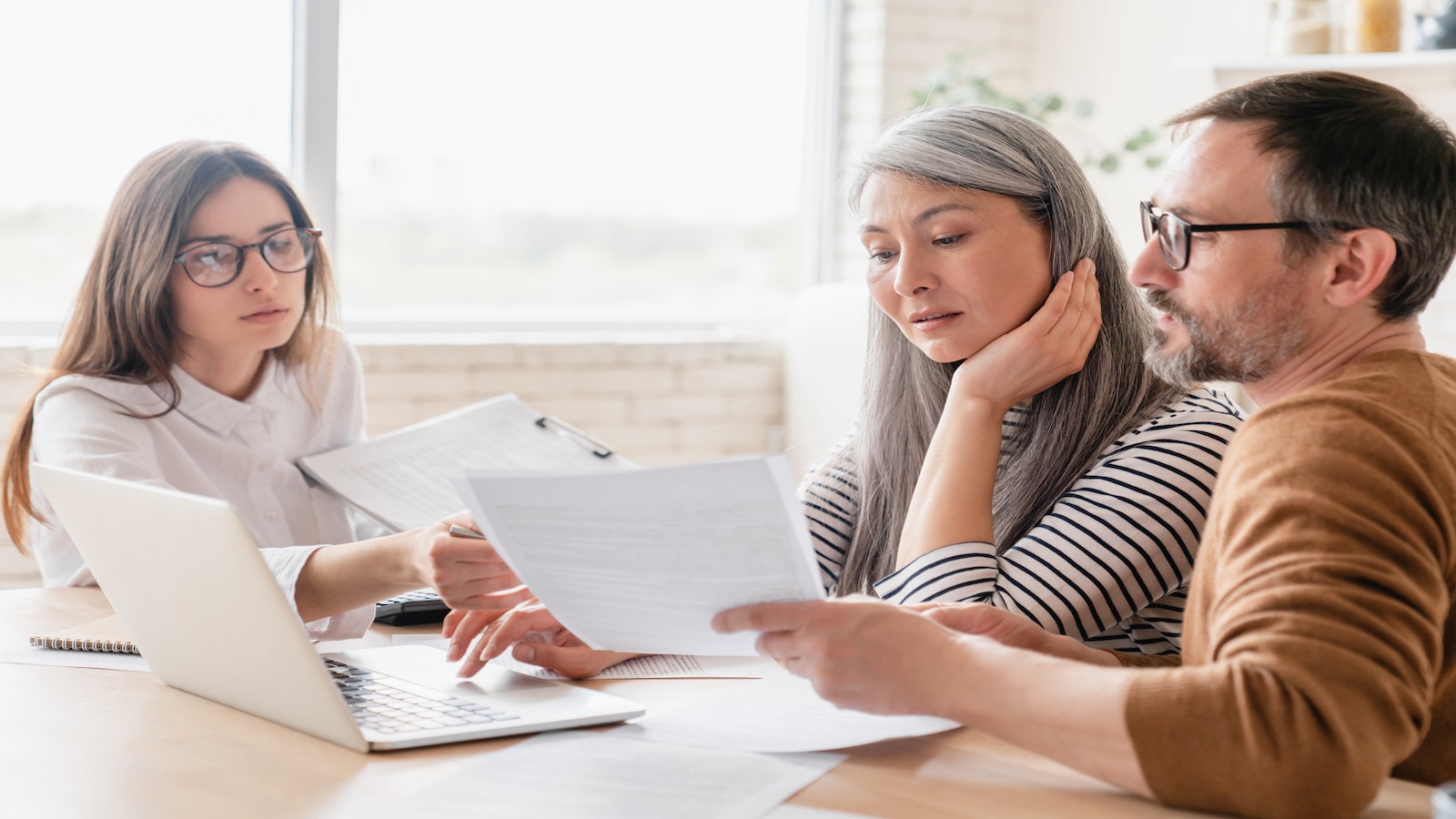 couple working with realtor.
