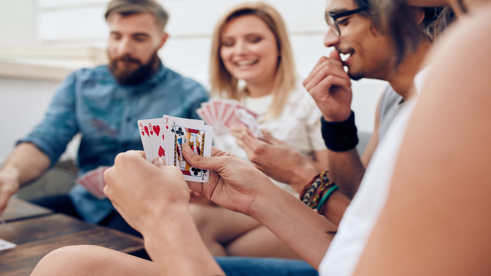 Group of friends playing cards.