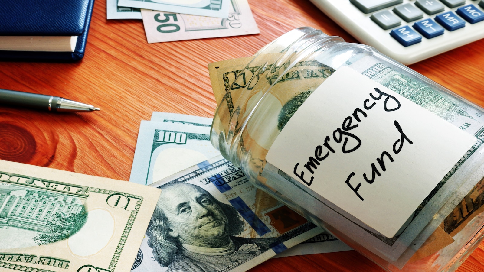 emergency fund concept with glass jar with cash.