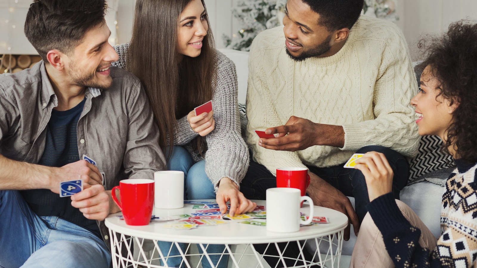 Happy friends playing uno.