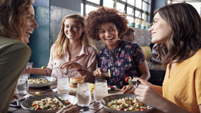 group of friends at restaurant having lunch together.