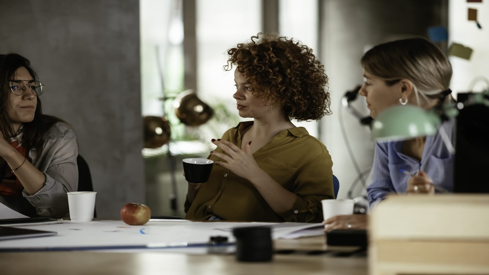 group of women talking at work.